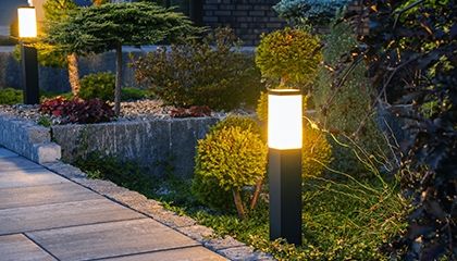 outdoor lights in front of home lighting up side walk